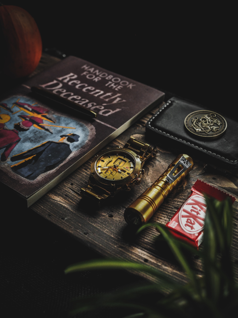 Leather Wallet, Reylight Pineapple, Mendoza Admiral Coin and a Kit Kat